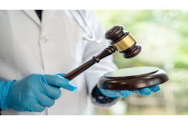 doctor-holding-judge-gavel-forensic-medicine-med-2023-11-28-04-44-03-utc (1).jpg